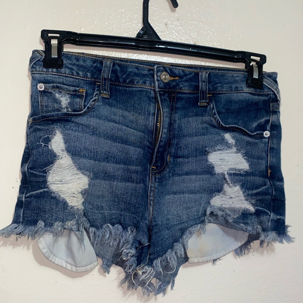 Medium wash front pocket showing denim shorts